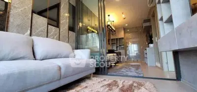 Luxurious modern living room with elegant decor and open layout in high-end apartment.