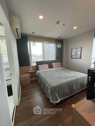 Modern bedroom with large window and stylish decor in urban apartment