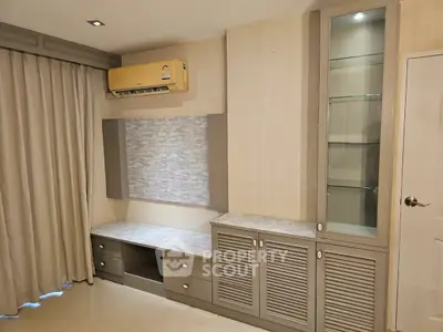 Modern living room with built-in storage and air conditioning