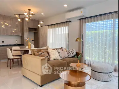 Modern living room with stylish decor and open kitchen layout