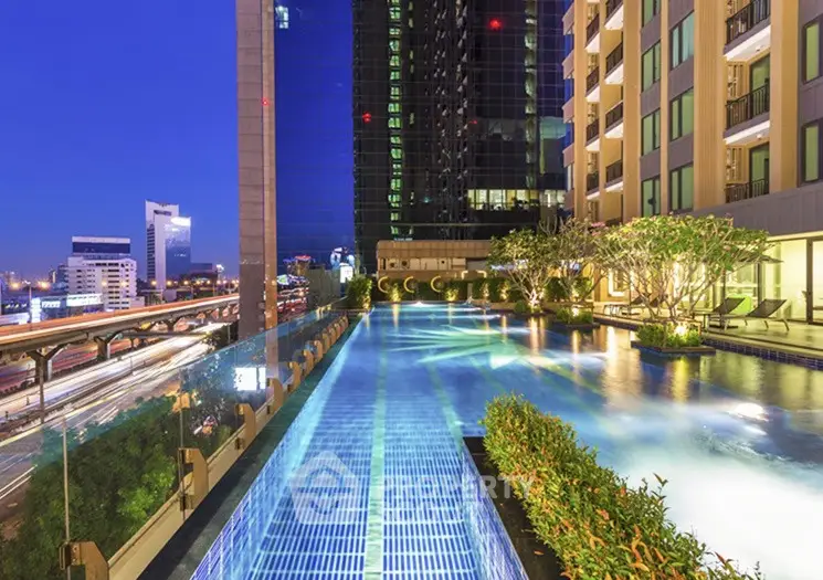 Luxurious rooftop pool with stunning city skyline view at night