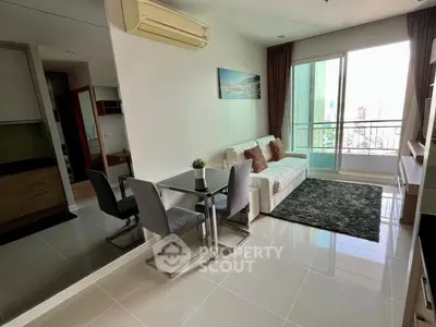 Modern living room with balcony and stylish decor in urban apartment