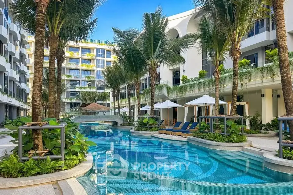 Luxurious resort-style pool area with lush greenery and modern architecture.