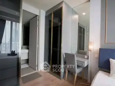 Modern bedroom with sleek design and ensuite bathroom in luxury apartment