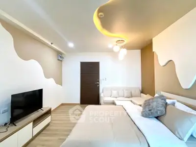 Modern bedroom with stylish decor and cozy seating area