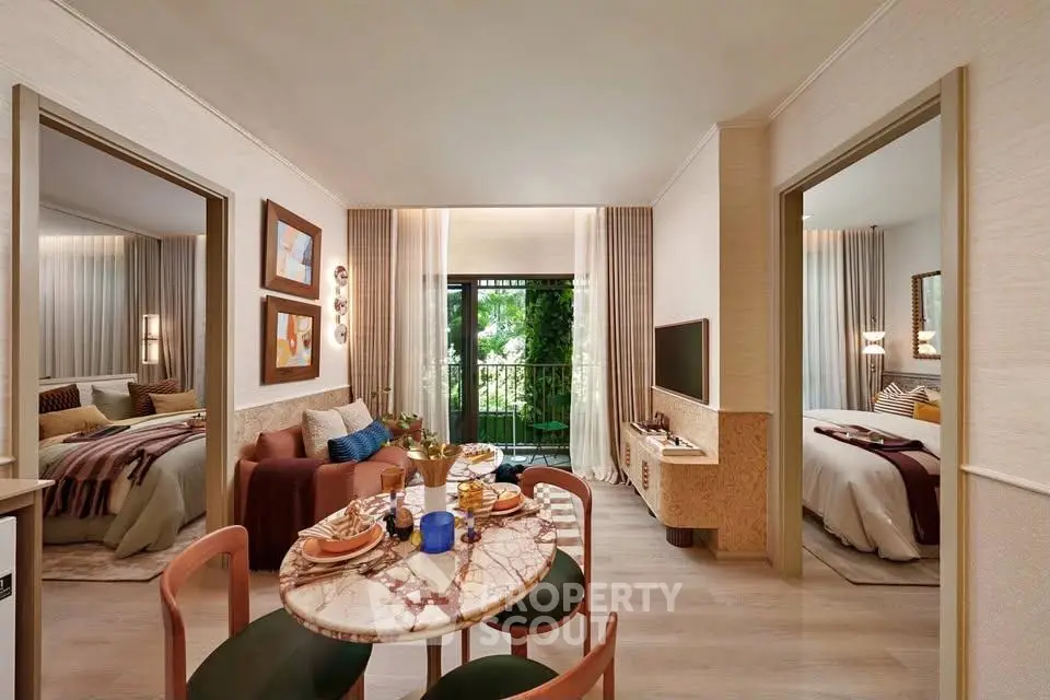 Luxurious open-plan living room with elegant dining area and balcony view in modern apartment.