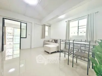 Bright and airy living room with modern furniture and large windows.