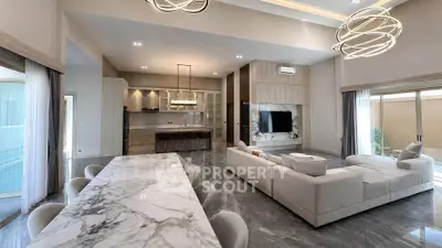 Luxurious open-plan living room with marble dining table and modern lighting