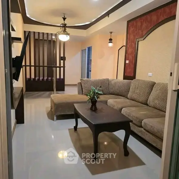 Spacious living room with elegant decor and cozy seating area