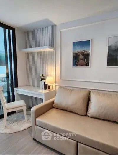 Modern living room with cozy sofa and stylish decor in a bright apartment.