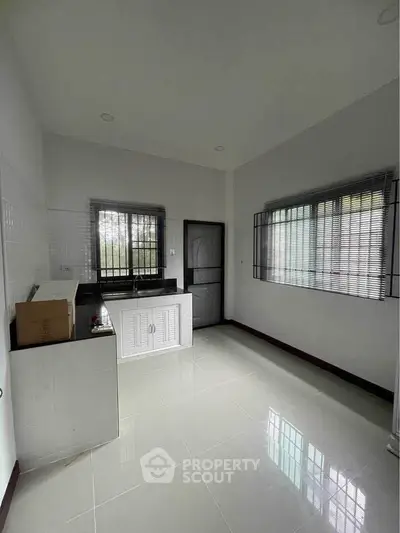 Spacious kitchen with modern design and ample natural light