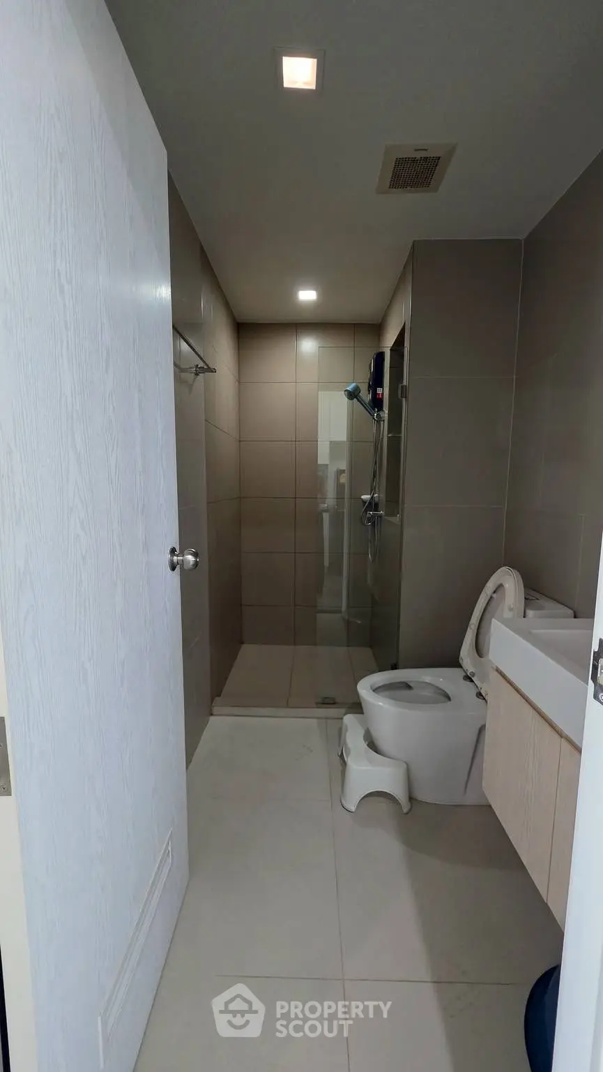 Modern bathroom with sleek design and glass shower enclosure