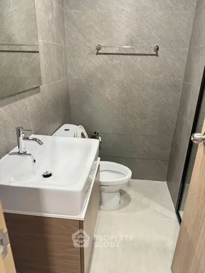 Modern bathroom with sleek design and contemporary fixtures, perfect for urban living.