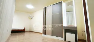 Spacious bedroom with modern wardrobe and minimalist decor