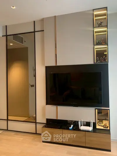 Modern living room with sleek TV setup and decorative shelving