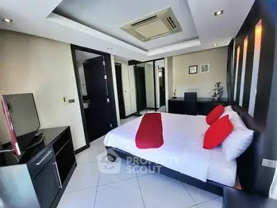 Modern bedroom with sleek design, featuring a comfortable bed, TV, and stylish decor.