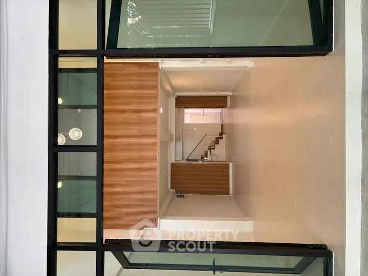 Modern interior with open layout and stylish wooden accents, perfect for contemporary living.