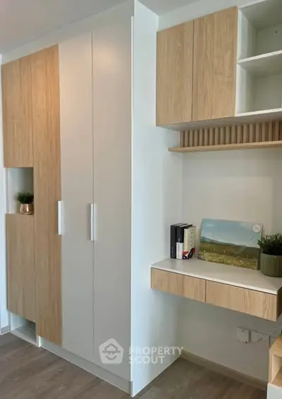 Modern study area with built-in wooden cabinets and desk
