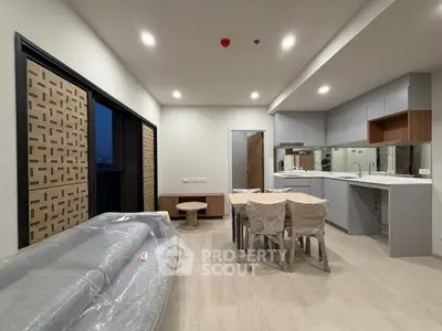 Modern open-plan living room with kitchen in new apartment