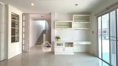 Spacious modern living area with built-in storage and natural light