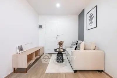 Modern minimalist living room with stylish decor and cozy seating area.