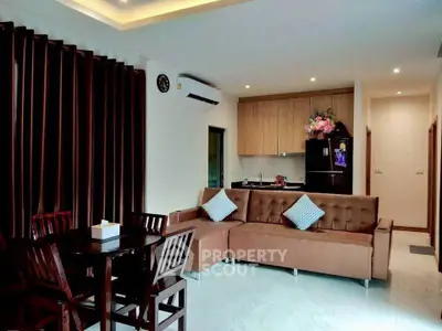 Modern living room with open kitchen and stylish furniture