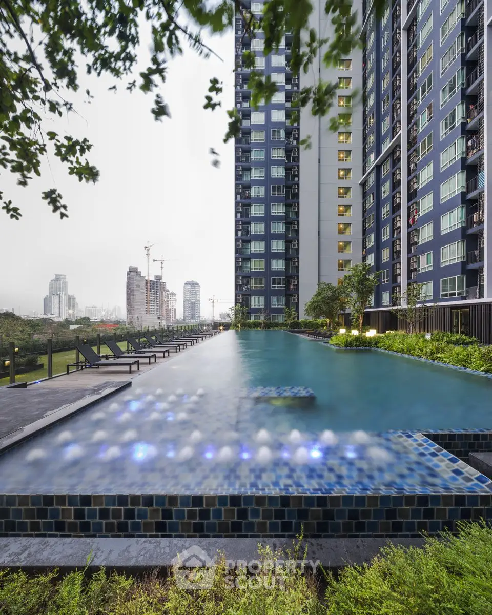 Luxurious high-rise apartment with stunning infinity pool and city skyline view.