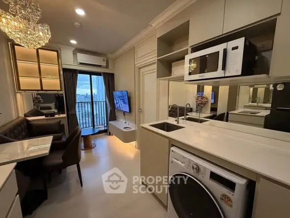 Modern apartment interior with open kitchen, cozy living area, and balcony view.