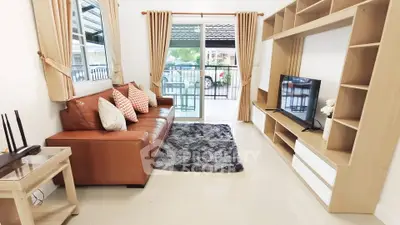 Modern living room with brown leather sofa, stylish shelving, and large window view.