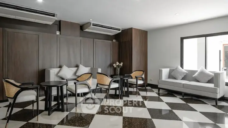 Modern living room with stylish furniture and checkered floor tiles