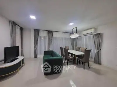 Spacious modern living room with elegant dining area and stylish furniture