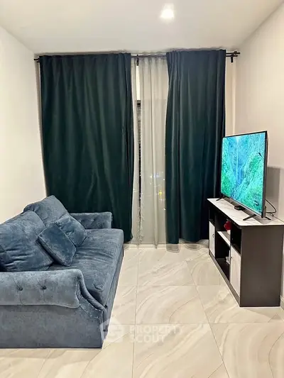 Cozy living room with plush sofa and modern TV setup