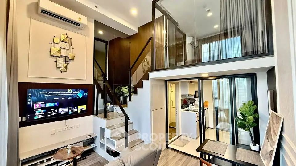 Modern duplex apartment with stylish decor and open layout, featuring a cozy living area and sleek kitchen.