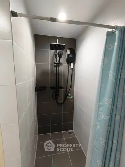 Modern bathroom with sleek shower design and stylish tiles