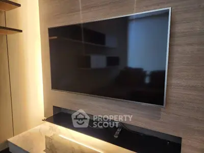 Modern living room with wall-mounted TV and elegant marble accents