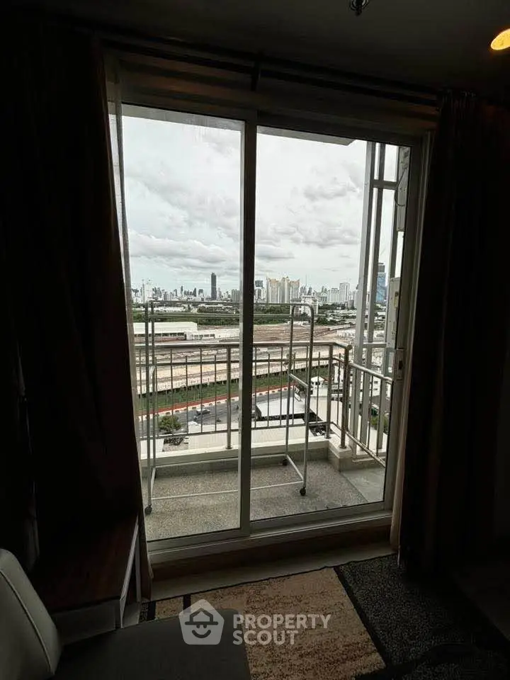 Spacious balcony with stunning city skyline view from modern apartment.