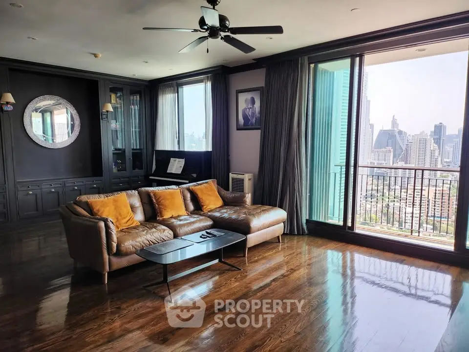 Luxurious living room with city view and elegant decor in high-rise apartment