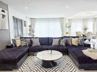 Luxurious modern living room with plush sectional sofa and chic decor
