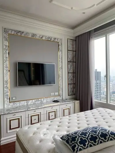 Luxurious bedroom with elegant marble accents and large window offering city views.
