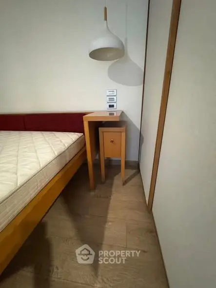 Modern bedroom with minimalist design and wooden furniture