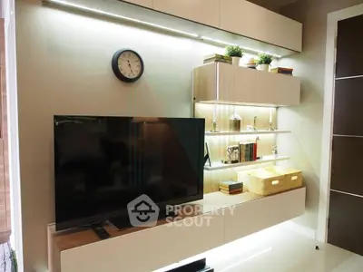 Modern living room with sleek TV unit and stylish shelving