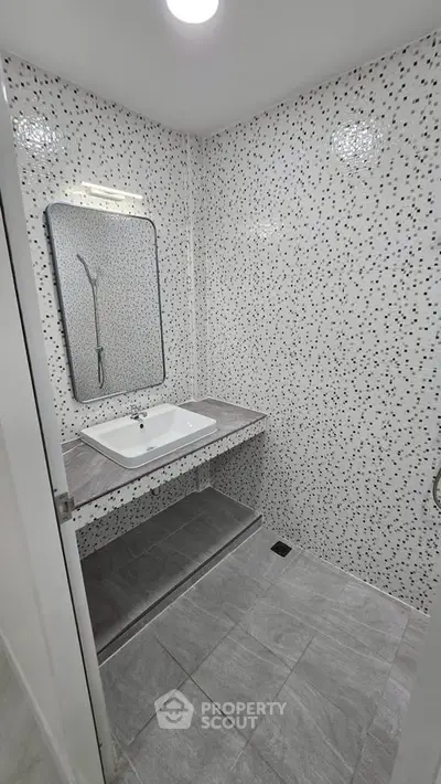 Modern bathroom with stylish tile design and sleek fixtures