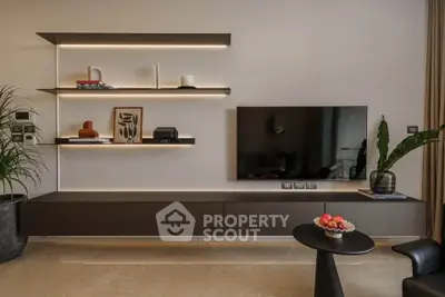 Modern living room with sleek shelving and wall-mounted TV, perfect for stylish urban living.