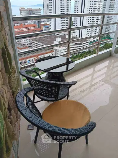 Stunning high-rise balcony with city view, perfect for relaxation and enjoying the skyline.