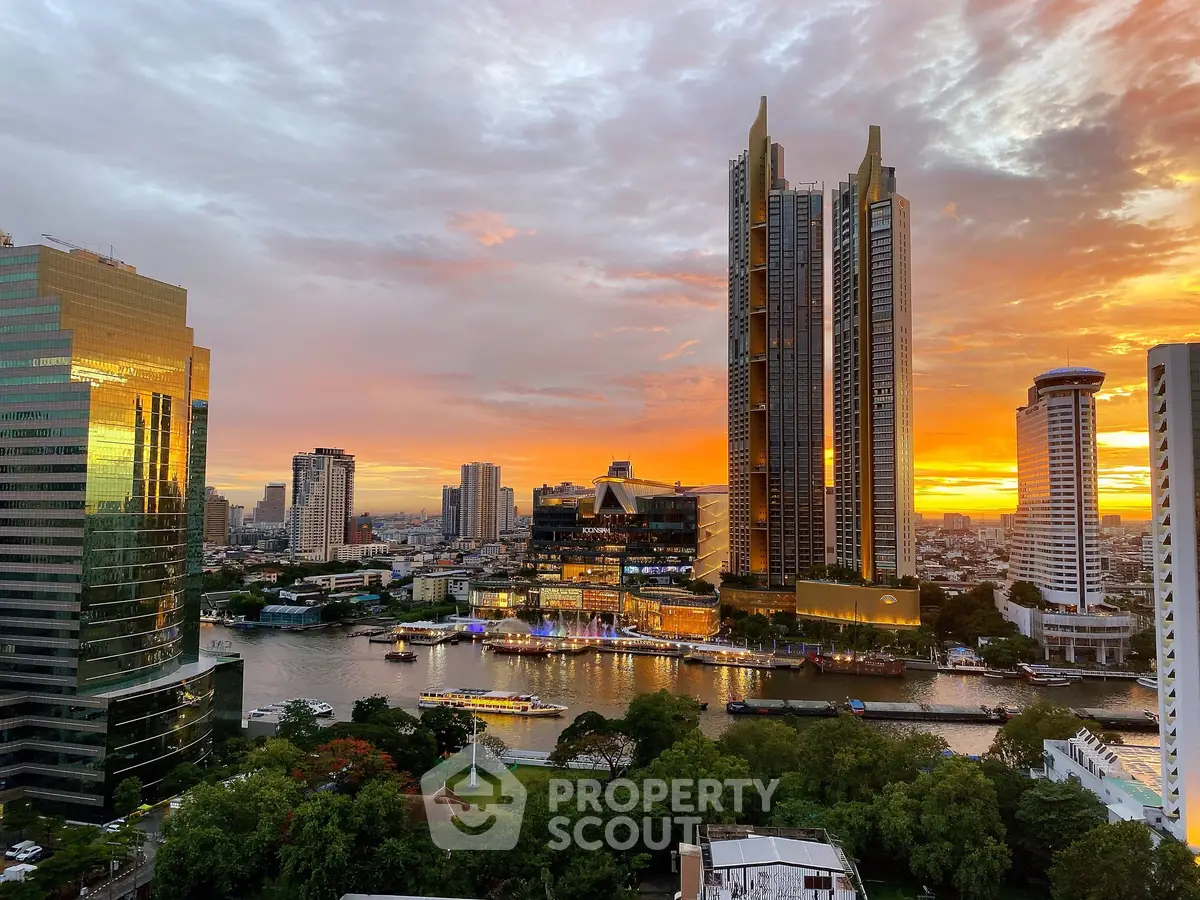 Stunning cityscape view with river and skyscrapers at sunset, showcasing urban luxury living.