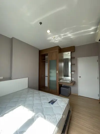 Modern bedroom with wooden wardrobe and natural light