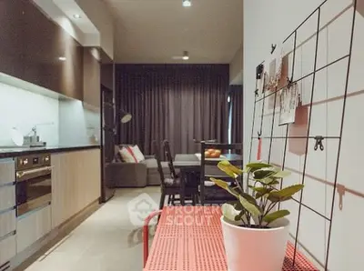 Modern open-layout kitchen with sleek appliances and cozy living area