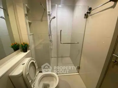 Modern bathroom with glass shower and sleek fixtures