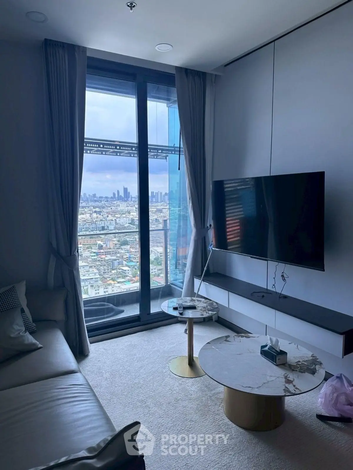 Modern living room with stunning city view and sleek decor