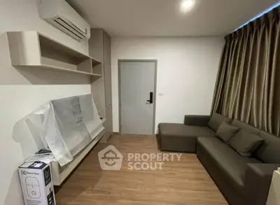 Modern living room with air conditioning and sleek furniture in a cozy apartment.